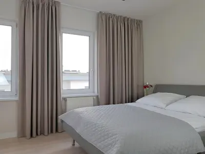 Łóżko lub łóżka w pokoju w obiekcie Chopin Apartments - Eco