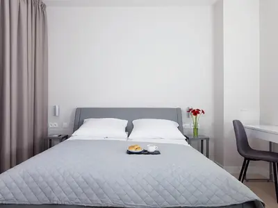 Łóżko lub łóżka w pokoju w obiekcie Chopin Apartments - Eco
