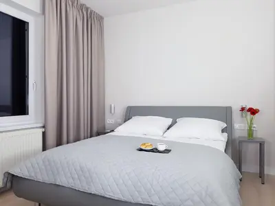Łóżko lub łóżka w pokoju w obiekcie Chopin Apartments - Eco