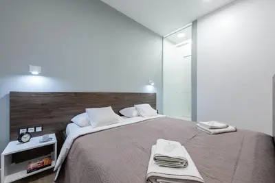 Łóżko lub łóżka w pokoju w obiekcie Apartament Luxury Miedzyborska 8b
