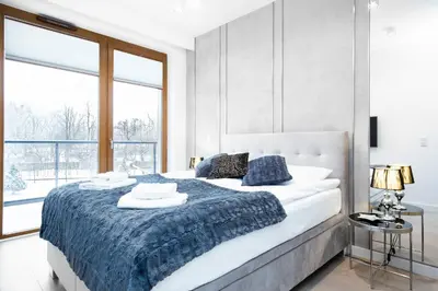 Łóżko lub łóżka w pokoju w obiekcie Apartments Warsaw Szamocka by Renters Prestige