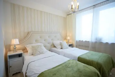 Łóżko lub łóżka w pokoju w obiekcie APARTAMENT IZABEL