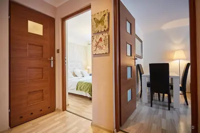 Łóżko lub łóżka w pokoju w obiekcie APARTAMENT IZABEL