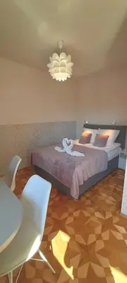 Łóżko lub łóżka w pokoju w obiekcie WILLA BAJLAND