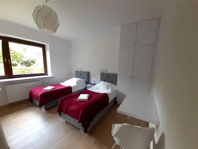 Łóżko lub łóżka w pokoju w obiekcie WILLA BAJLAND
