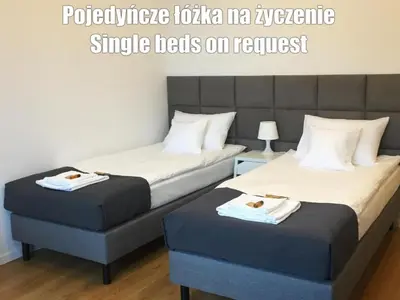 Łóżko lub łóżka w pokoju w obiekcie Vista Residence Premium - Free Underground Parking - City Center - Self Check-in