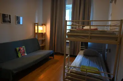 Łóżko lub łóżka w pokoju w obiekcie Pepe Hostel