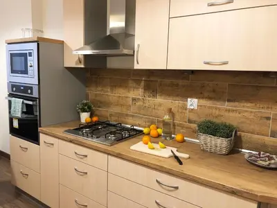 Kuchnia lub aneks kuchenny w obiekcie Aleja 3 maja 7 by Homeprime