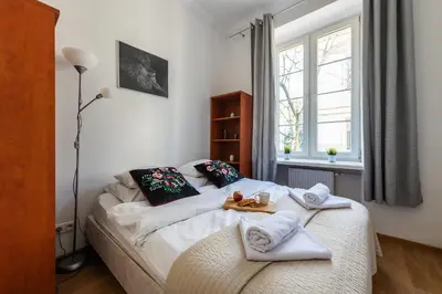 Łóżko lub łóżka w pokoju w obiekcie MIODOWA Street P&O Serviced Apartments