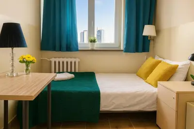 Łóżko lub łóżka w pokoju w obiekcie V Ajax Warsaw Bed&Breakfast ROOMS