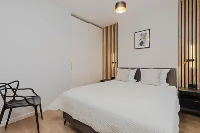 Łóżko lub łóżka w pokoju w obiekcie VIDOC APARTMENTS