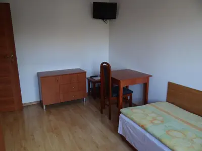 Łóżko lub łóżka w pokoju w obiekcie Willa Ewa