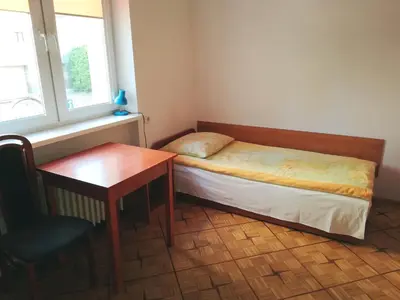 Łóżko lub łóżka w pokoju w obiekcie Willa Ewa