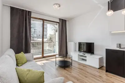 Telewizja i/lub zestaw kina domowego w obiekcie Chill Apartments Wola