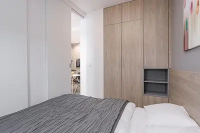 Łóżko lub łóżka w pokoju w obiekcie Chill Apartments Wola