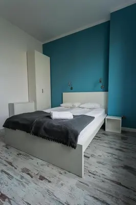 Łóżko lub łóżka w pokoju w obiekcie Apartamenty Planet