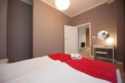 Łóżko lub łóżka w pokoju w obiekcie Apartamenty Planet