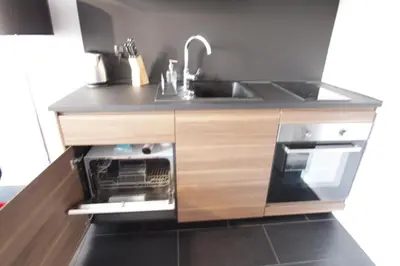 Kuchnia lub aneks kuchenny w obiekcie KRÓLEWSKA Apartament HAPPY HOME