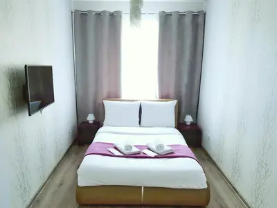 Łóżko lub łóżka w pokoju w obiekcie Warsaw Royal Stay Aleja Jana Pawła II