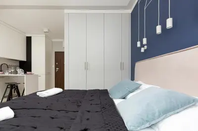 Łóżko lub łóżka w pokoju w obiekcie Apartments Warsaw Pawia by Noclegi Renters