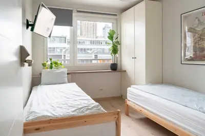 Łóżko lub łóżka w pokoju w obiekcie Chmielna - City Center Residence