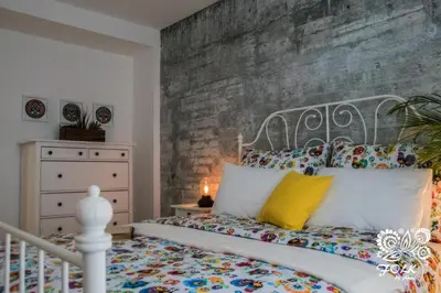 Łóżko lub łóżka w pokoju w obiekcie Folk by Anne Apartments & Rooms
