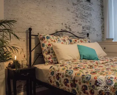 Łóżko lub łóżka w pokoju w obiekcie Folk by Anne Apartments & Rooms