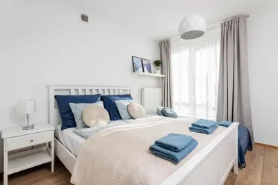 Łóżko lub łóżka w pokoju w obiekcie Jonagold Apartment Metro Raclawicka