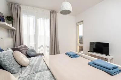 Łóżko lub łóżka w pokoju w obiekcie Jonagold Apartment Metro Raclawicka