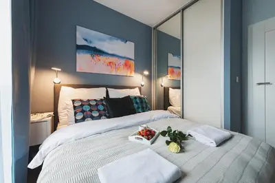 Łóżko lub łóżka w pokoju w obiekcie Airport Okecie Wagonowa Serviced Apartments