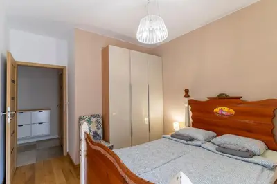 Łóżko lub łóżka w pokoju w obiekcie FIRST -- Green Żoliborz apartment 1