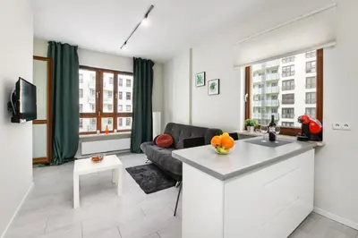 Telewizja i/lub zestaw kina domowego w obiekcie Warsaw Night Apartments Giełdowa