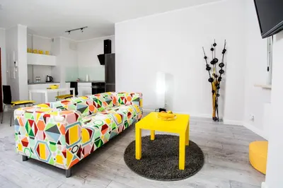 Łóżko lub łóżka w pokoju w obiekcie Warsaw Night Apartments Giełdowa