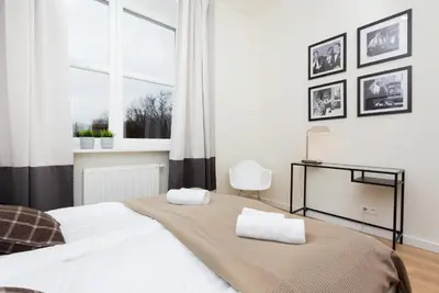 Łóżko lub łóżka w pokoju w obiekcie Apartments Warsaw Gagarina by Noclegi Renters