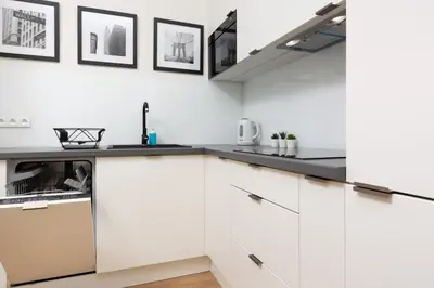 Kuchnia lub aneks kuchenny w obiekcie Apartments Warsaw Gagarina by Noclegi Renters