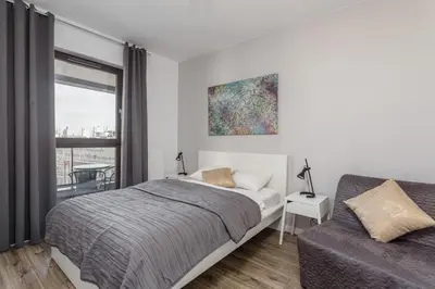 Łóżko lub łóżka w pokoju w obiekcie Chill Apartments Wolska 45