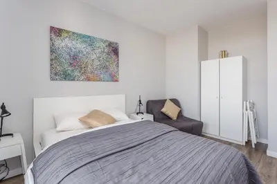 Łóżko lub łóżka w pokoju w obiekcie Chill Apartments Wolska 45