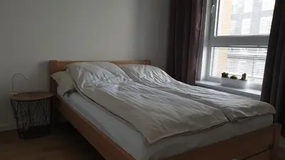 Łóżko lub łóżka w pokoju w obiekcie Quo Vadis Apartment