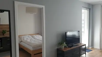 Telewizja i/lub zestaw kina domowego w obiekcie Quo Vadis Apartment