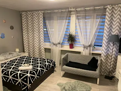 Łóżko lub łóżka w pokoju w obiekcie Apartament Centrum Pańska