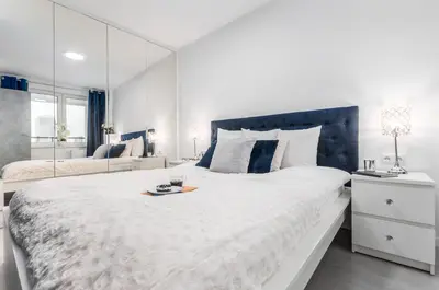 Łóżko lub łóżka w pokoju w obiekcie Apartments Golden Warsaw by Noclegi Renters