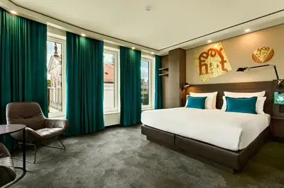 Łóżko lub łóżka w pokoju w obiekcie Motel One Warsaw-Chopin