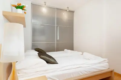 Łóżko lub łóżka w pokoju w obiekcie Apartment Warsaw Wilanowska by Noclegi Renters
