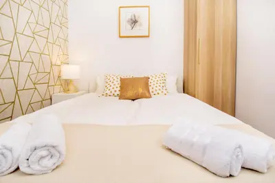Łóżko lub łóżka w pokoju w obiekcie erApartments Browary Warszawskie