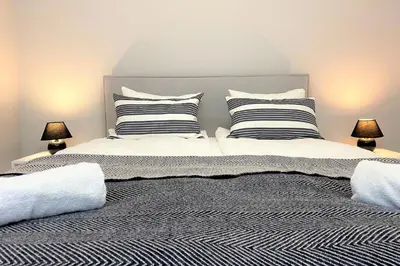 Łóżko lub łóżka w pokoju w obiekcie erApartments Browary Warszawskie
