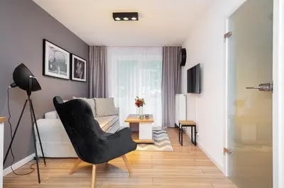 Telewizja i/lub zestaw kina domowego w obiekcie Apartments Parks of Warsaw by Noclegi Renters