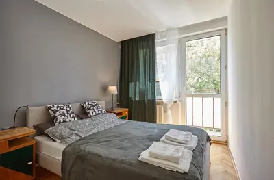 Łóżko lub łóżka w pokoju w obiekcie Apartament - Stara Ochota