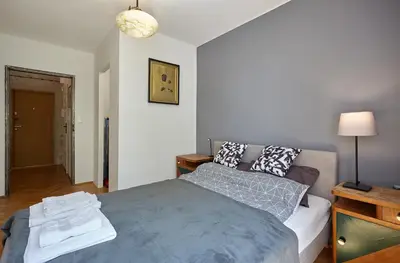Łóżko lub łóżka w pokoju w obiekcie Apartament - Stara Ochota