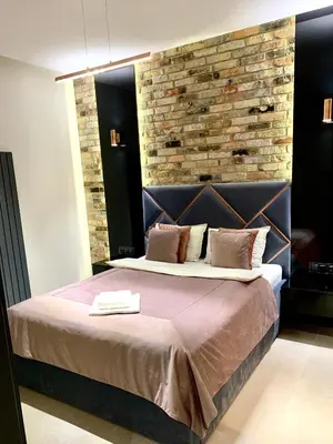 Łóżko lub łóżka w pokoju w obiekcie ZLOTA Luxury Apartments