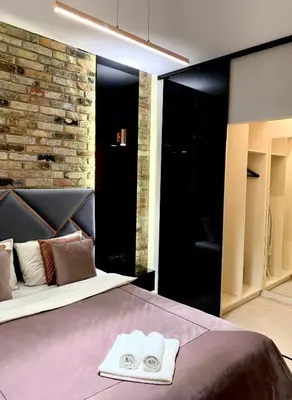 Łóżko lub łóżka w pokoju w obiekcie ZLOTA Luxury Apartments